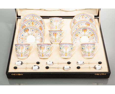 ROYAL WORCESTER COFFEE SERVICE
comprising six cups and six saucers, transfer printed with urns of flowers and scrolling folia