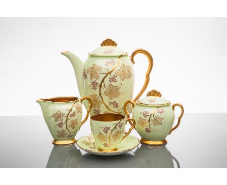 ART DECO CARLTON WARE COFFEE SET
decorated with gilt and mauve enamel grape vines on a mint ground, comprising a coffee pot, 