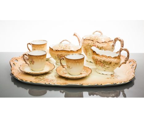 EARLY 20TH CENTURY LIMOGES TEA SERVICE
comprising three teacups and saucers, teapot, sugar, cream and tray, each decorated wi