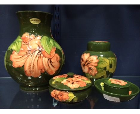 COLLECTION OF MOORCROFT 'HIBISCUS' PATTERN CERAMICS
including a vase of squat baluster form, signed to base in green 'WM', a 