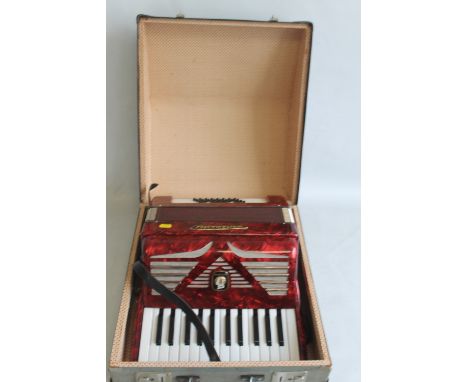 A WORLD MASTER PIANO ACCORDION IN CARRY CASE