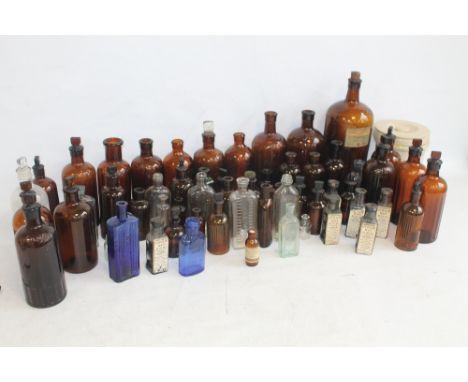 A COLLECTION OF VINTAGE BOTTLES MAINLY BROWN POISON TYPES, with glass stoppers and six sealed "Straw Hat Revival" with origin
