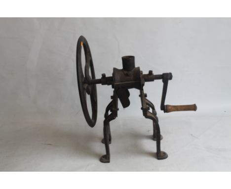 A 19TH CENTURY SHOP COUNTER COFFEE GRINDER, cast iron with large fly wheel