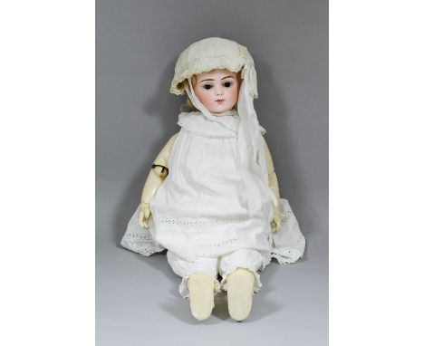 A late 19th Century French Bru Jaune R9 bisque headed Walking/ Talking/ Kiss Throwing doll, the bisque head with closing brow