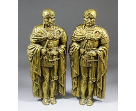 A pair of early 20th Century cast brass standing figures of Roman Centurions, the backs stamped in relief "D.K.", 20.25ins (p