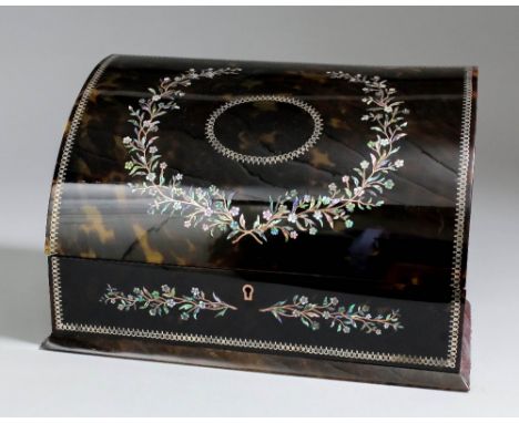 A late Victorian tortoiseshell and leather covered stationary box, the curved lid and front inlaid with mother of pearl and m