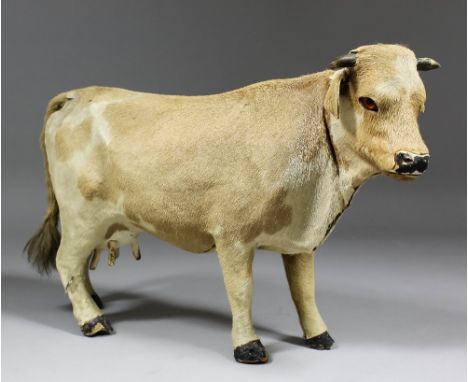 A 19th Century French automaton modelled as a standing cow, the moving head issuing a sound, 9.75ins high (slight damage thro