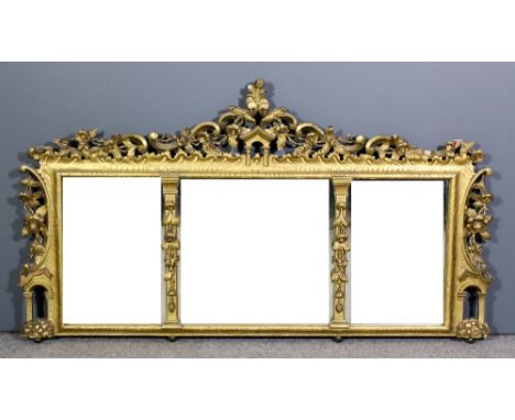 A 20th Century gilt wood framed rectangular overmantel mirror of Chippendale design, cresting and sides boldly fretted and ca