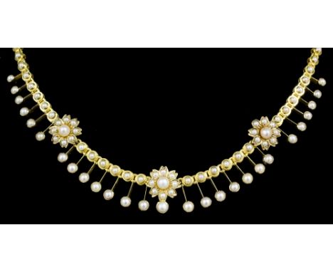 A late Victorian gold coloured metal mounted all seed pearl set fringe pattern necklace, the face with three seed pearl set f