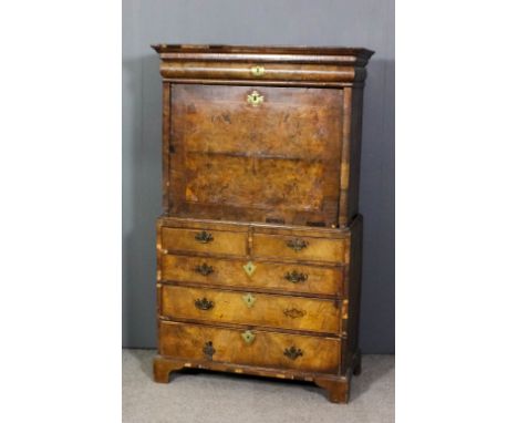 A mid 18th Century walnut secretaire a abattant the upper part with moulded cornice above single cushion fronted cornice draw