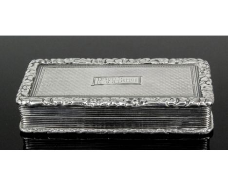 A William IV silver rectangular vinaigrette of large proportions with cast floral and leaf scroll mounts to lid and base and 
