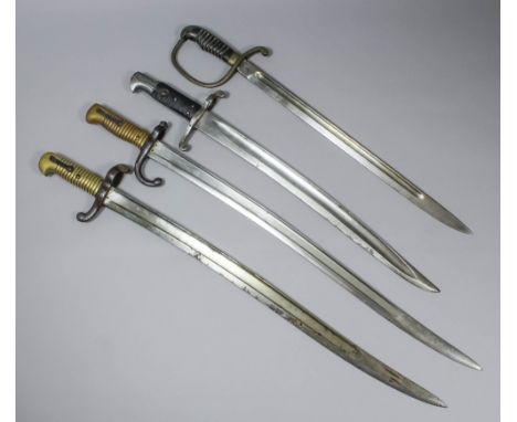 A British short sword, the 17.25ins blade stamped with a crown over "ER" and "1907" and "Wilkinson", with horn grip and brass