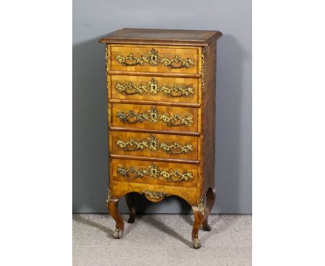 A French walnut and gilt brass mounted petit commode, the top and draw fronts cross banded and with gilt brass rococo pattern
