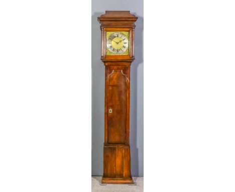 An 18th Century oak longcased clock the 11ins square brass dial with wide silvered chapter ring with Roman Arabic numerals an