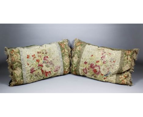 A pair of Aubusson tapestry cushions, the central panels worked with flowers, fringed and braided, each 20ins x 12ins 