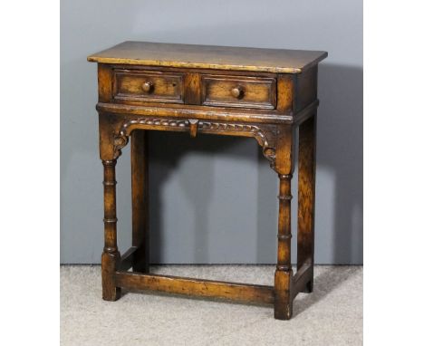 A Titchmarsh & Goodwin oak side table, fitted one frieze drawer with moulded front, carved frieze and on turned legs and plai