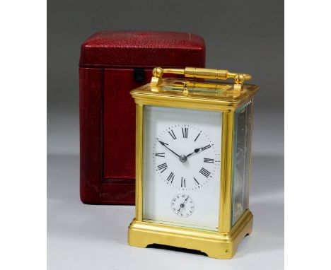 An early 20th Century French carriage clock, the white enamelled dial with Roman numerals to the eight day two train movement