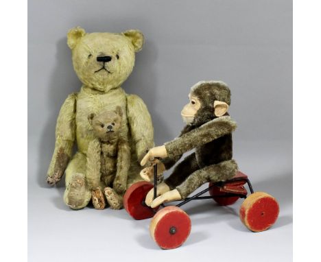 An early 20th Century Continental miniature teddy bear in the Steiff manner, in old gold mohair with "boot black" eyes and jo