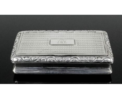 A George IV silver rectangular snuff box with incurved sides, the lid and base with engine turned ornament and with leaf scro