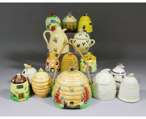 A small collection of ceramic honey pots and bee related items, including - Royal Winton pottery biscuit barrel and cover mod