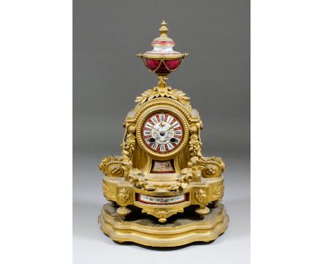 A 19th Century French gilt metal and porcelain mounted mantle clock by J.W.B No. 26690, the 3ins diameter porcelain dial with