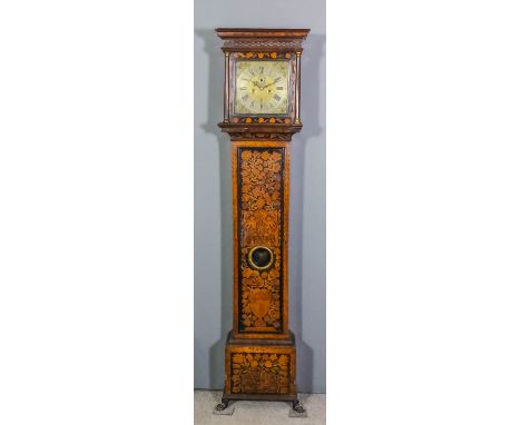 An early 18th Century walnut and marquetry longcase clock by William Speakman Junior of London, the 11ins square brass dial w