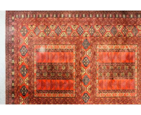 A modern Belgian machine made carpet of Tekke Ensi design woven in brown, blue, ivory and rose, two large rectangular medalli