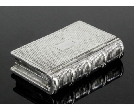 A William IV silver rectangular book pattern vinaigrette with moulded spine and engine turned lid and base and with pierced a