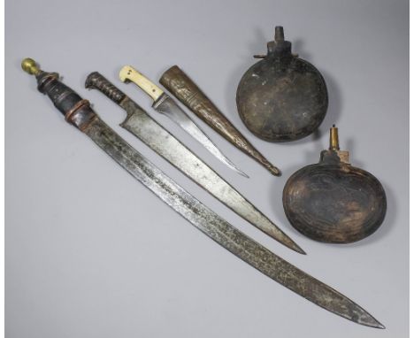 A Khyber long knife, the 16.25ins blade with carved wood grip (partially missing), 21ins overall, an Indo Persian dagger, the