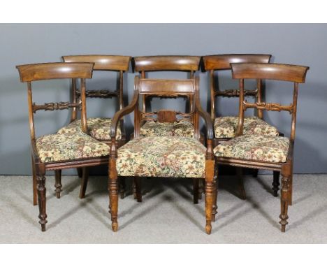 A set of five William IV rosewood dining chairs with plain curved crest rails, carved splats, drop in seats upholstered in fl