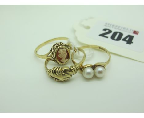 A 9ct Gold Pearl Set Ring, between plain shoulders (finger size N), a 9ct gold dress ring, in the form of clasped hands (fing