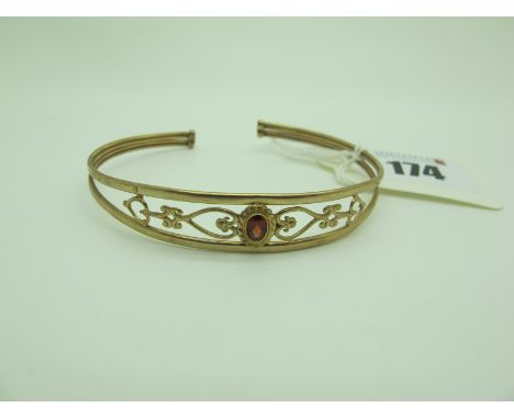 A Modern 9ct Gold Bangle, of openwork design, oval collet set to the centre (5grams). 