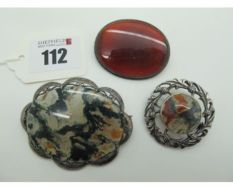 A Moss Agate Oval Panel Brooch, within shaped pierced setting, stamped "Silver"; together with a Scottish hallmarked silver b