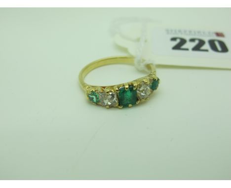 A Victorian Style Emerald and Diamond Five Stone Ring, within carved setting (finger size Q). 
