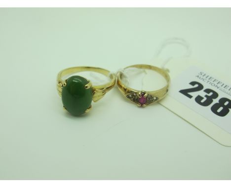 A Single Stone Dress Ring, oval cabochon four claw set, between tapering shoulders, stamped "18k" (finger size S) (4.2grams);