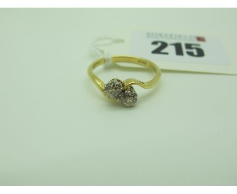 A Two Stone Diamond Crossover Ring, claw set with old cut stones, stamped "18ct Plat" (finger size M1/2) (2.5grams). 