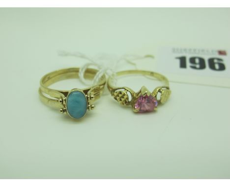 An Unusual Rotating Ring, double hardstone cabouchon centre, between two plain bands, stamped "14K", (finger size P½), a mode
