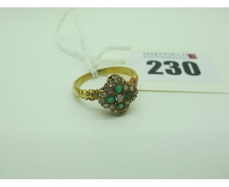 An Antique Style Emerald and Diamond Set Cluster Ring, millegrain set, between shaped shoulders (finger size O).