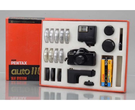 A Pentax Auto 110 Outfit, shutter working, body G-VG, with 24mm f/2.8, 16mm f/2.8, 50mm f/2.8 lenses, G-VG, nine filters, in 