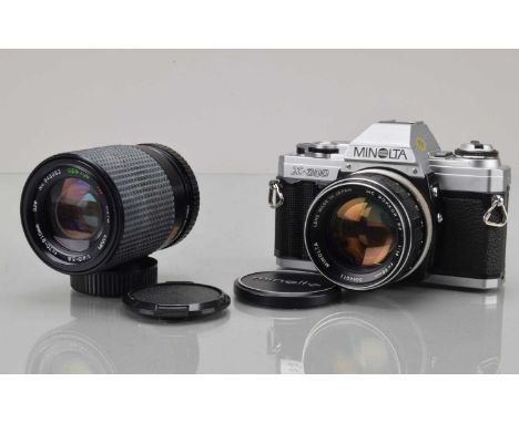 A Minolta X-300 SLR Camera, shutter working, meter responsive, camera responsive, self timer working, body G-VG, with MC Rokk