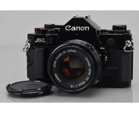 A Canon A-1 SLR Camera, black, shutter erratic, meter responsive, self time not working, body G-VG, with FD 50mm f/1.8 lens, 