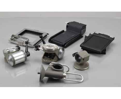 Large Format Camera Accessories, two Sinar Norma pan and tilt tripod heads, one with rail clamp, a Sinar rail clamp, Toyo Vie