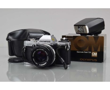 An Olympus OM-10 SLR Camera, shutter working, camera responsive, meter responsive, self timer working, body G-VG, with Zuiko 