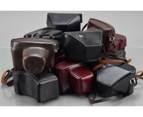 Two Trays of Leica Ever Ready Cases, two Leica M cases, six red Leica R cases, and seven black Leica M cases, G