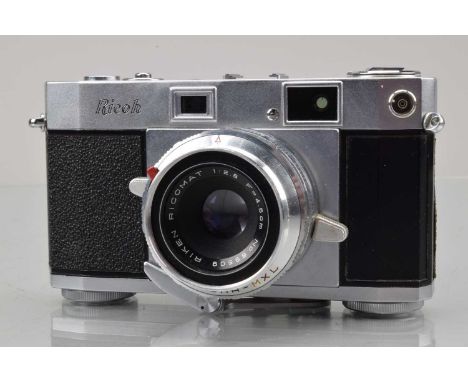 A Ricoh 500 Rangefinder Camera, shutter sticking in slow speeds, body G, missing leatherette from R/H front side, with 45mm f