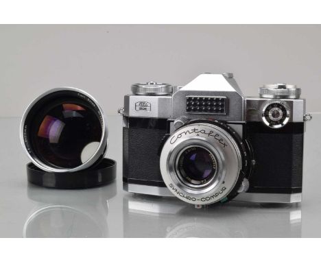A Zeiss Ikon Conaflex Super SLR Camera, shutter working, meter responsive, body G-VG, with Car Zeiss 50mm f/2. Tessar and 115