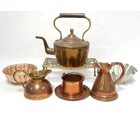 A selection of copper and brassware, including a brass iron stand, a copper kettle and other similar items (a lot).
