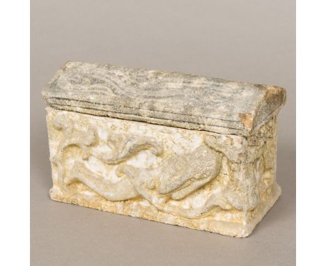 A carved and reconstituted stone model of a sarcophagus, the arched lift-off cover above stylised female figures, standing on