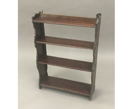 A Victorian mahogany hanging shelf