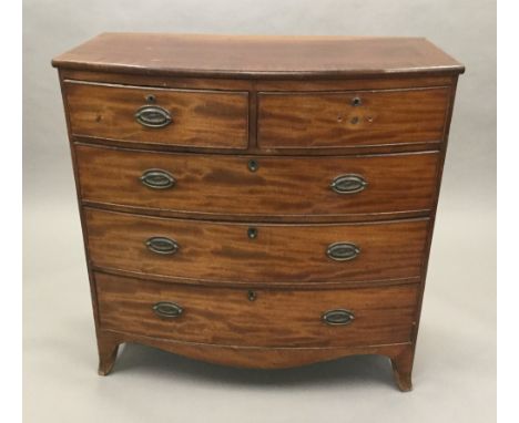 A 19th century mahogany bow front chest of drawers, with two short drawers over two long drawers. 104 cm wide